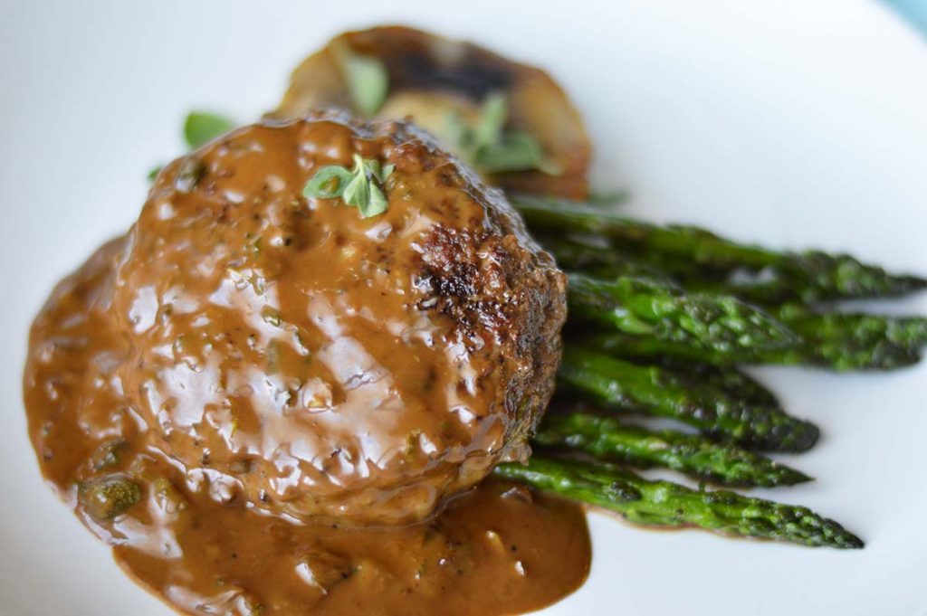 Ground Beef Steak with Portobello, Asparagus and a CaperBalsamic Cream